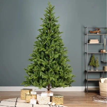 A full bodied artificial green Christmas tree